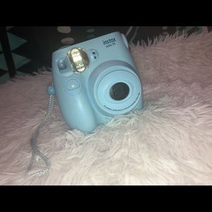 Baby blue Instax Mini 7S polaroid camera